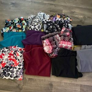 Bundle of large scrub tops and large tall bottoms.